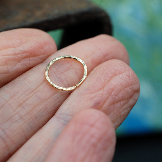 yellow gold oval nose ring hammered to reflect light
