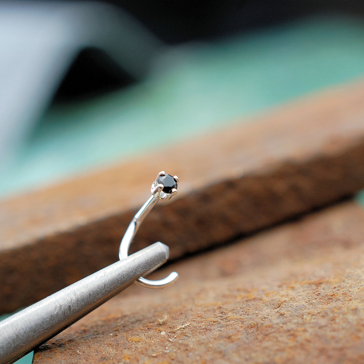 little black nose ring