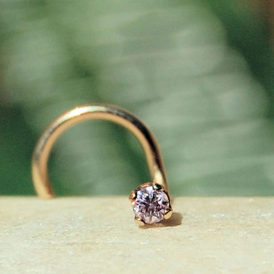 tiny gemstone nose stud in 14 karat gold