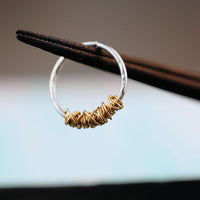 organic silver septum ring with gold tangle
