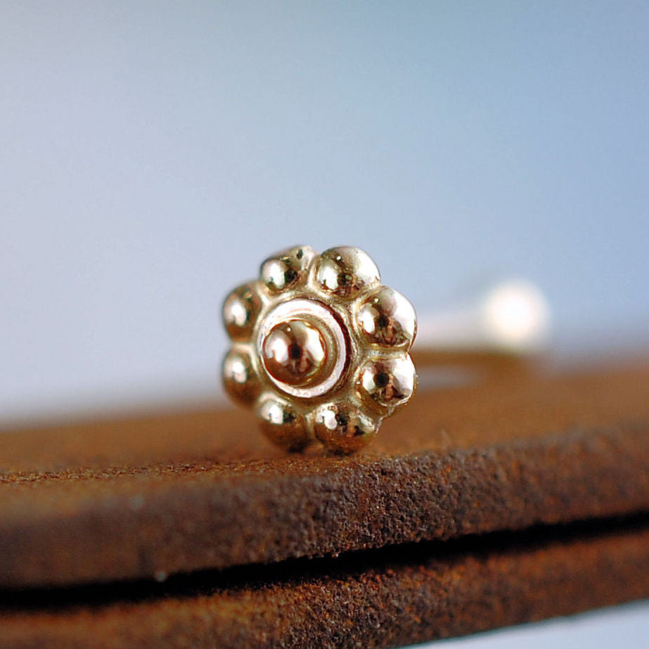 dainty flower nose stud in 14k yellow gold