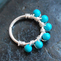 sterling silver nose hoop wrapped with turquoise gemstones