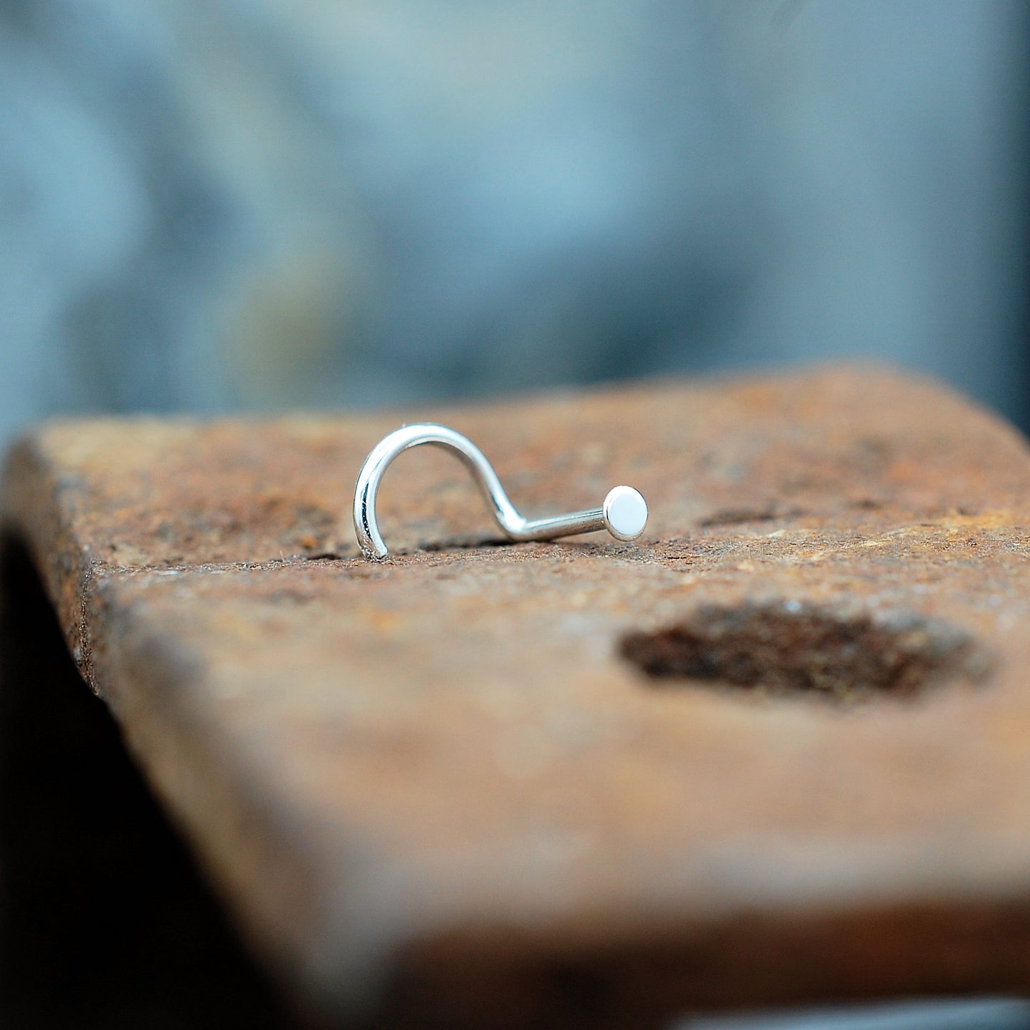 silver dot 2mm nose stud on brick