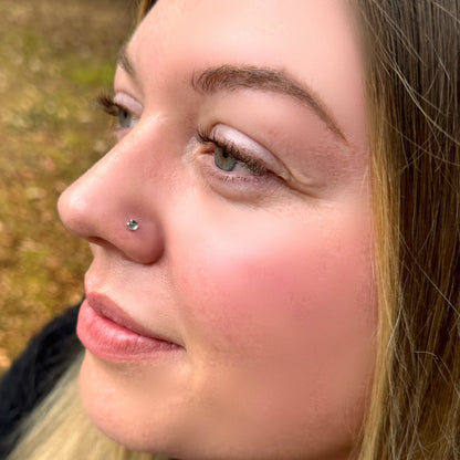 white topaz nose stud on a model 