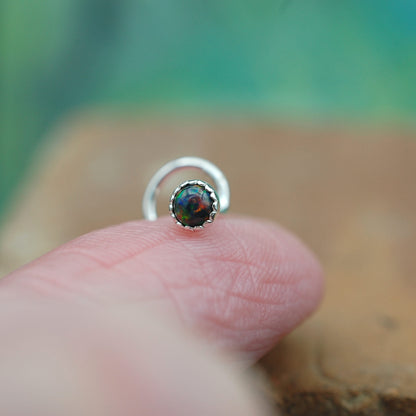 Silver nose stud with black opal gemstone
