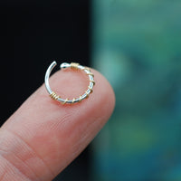 gold wrapped on silver nose ring