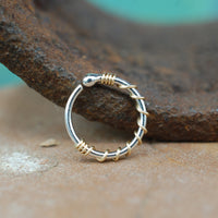 budded silver nose ring wrapped in gold
