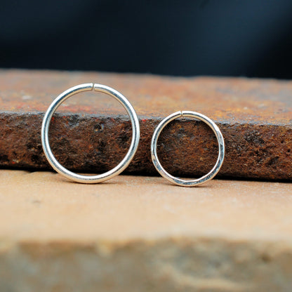 two silver nose rings hammered and sleek