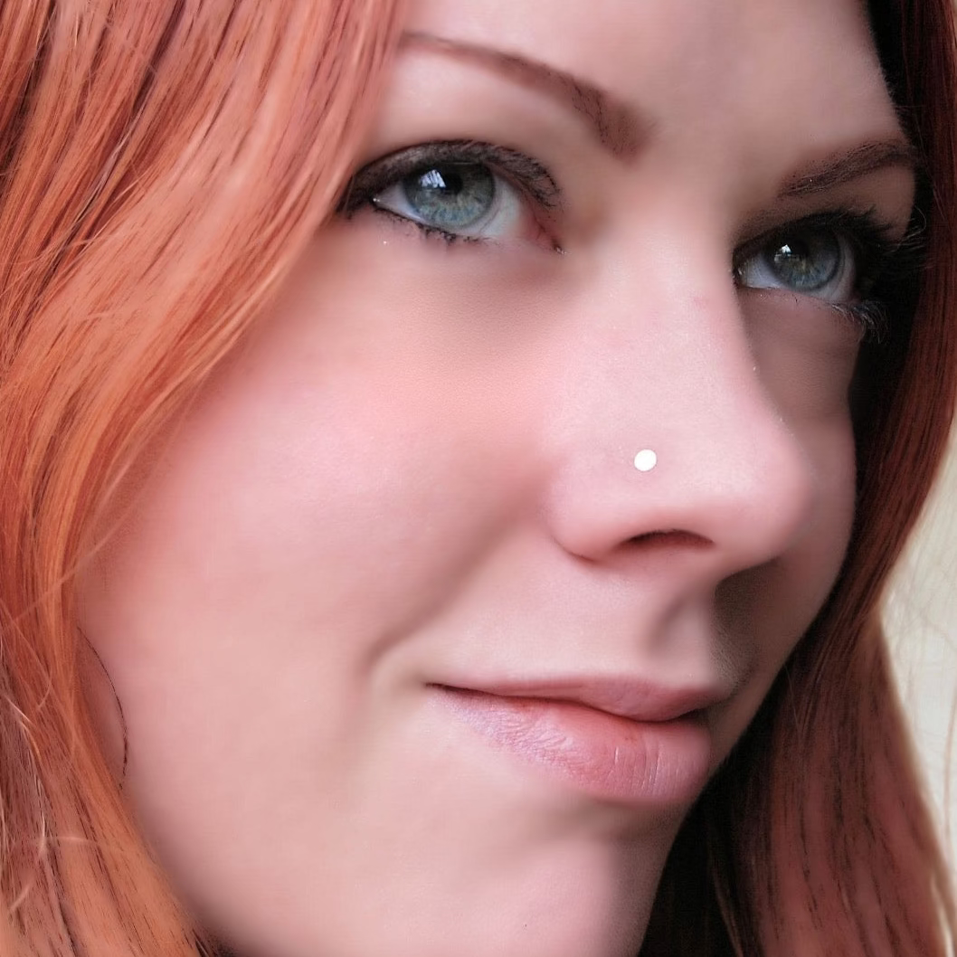 gold spot nose stud on a woman