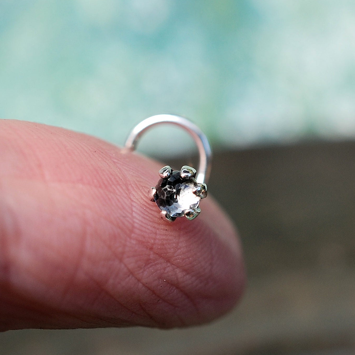 rose cut white topaz nose stud set in a silver claw setting