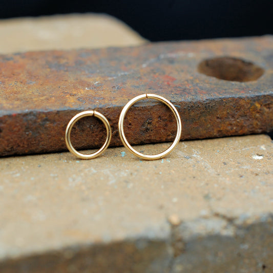 pair of yellow gold nose rings