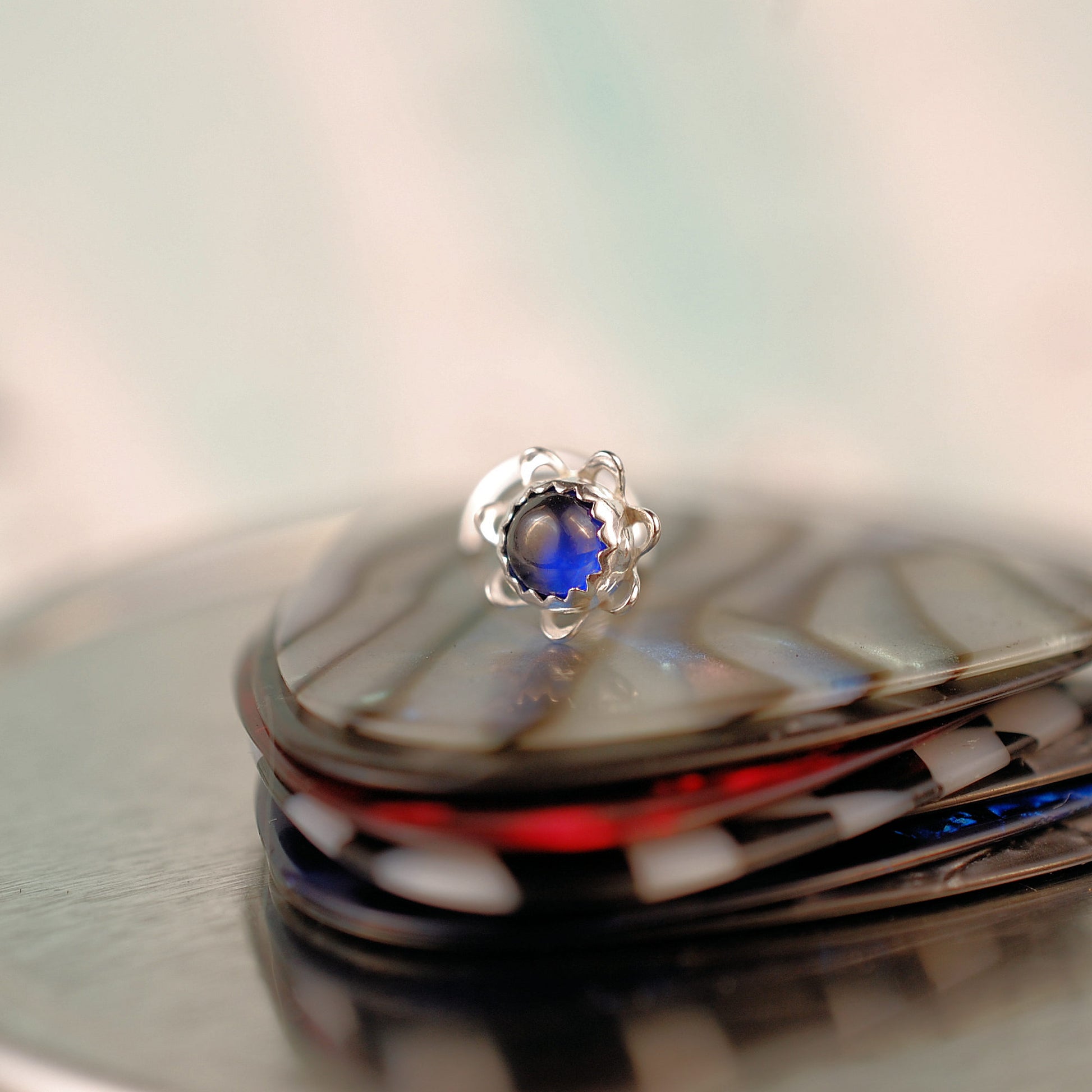 flower nose stud with sapphire stone in sterling silver