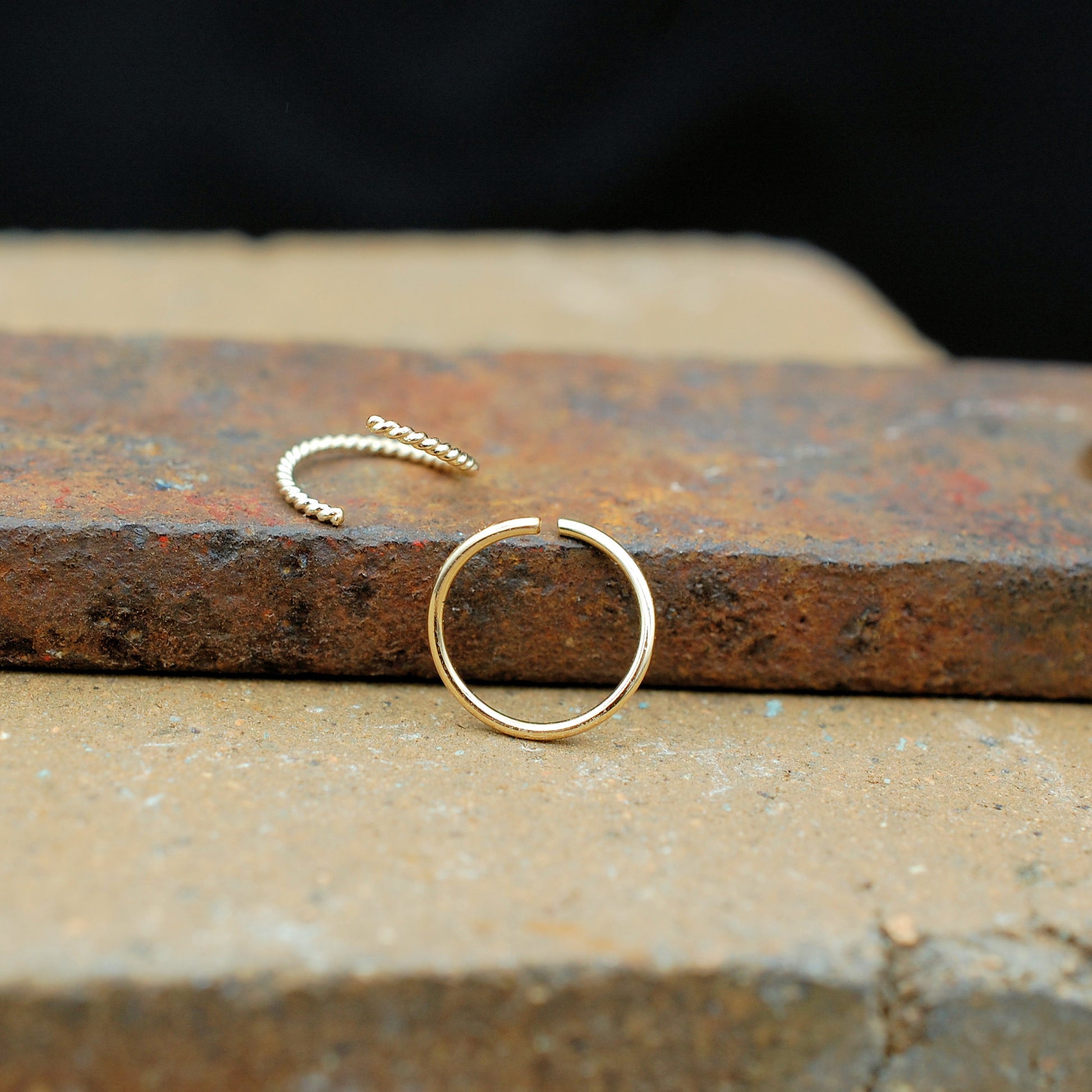 gold nose ring set shown open in endless ring style
