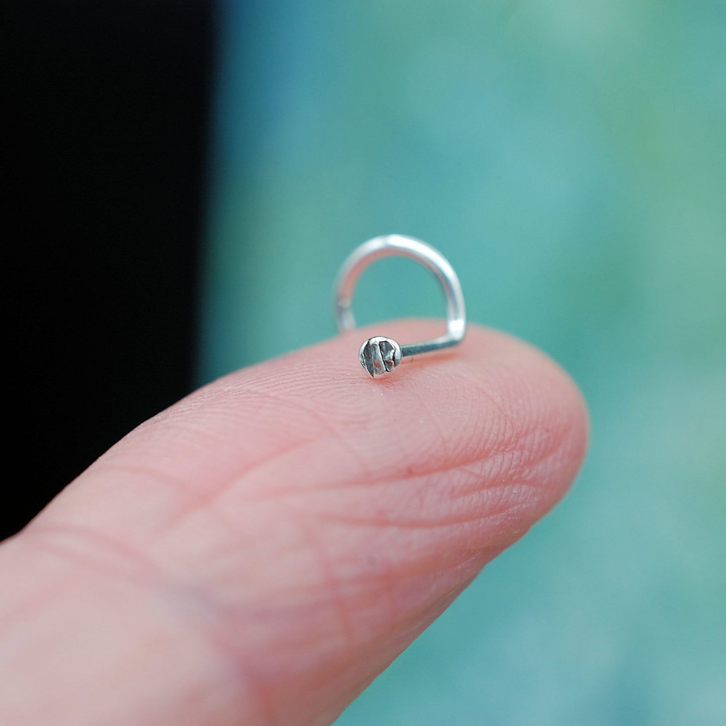 tiny silver dot disc nose stud textured pattern