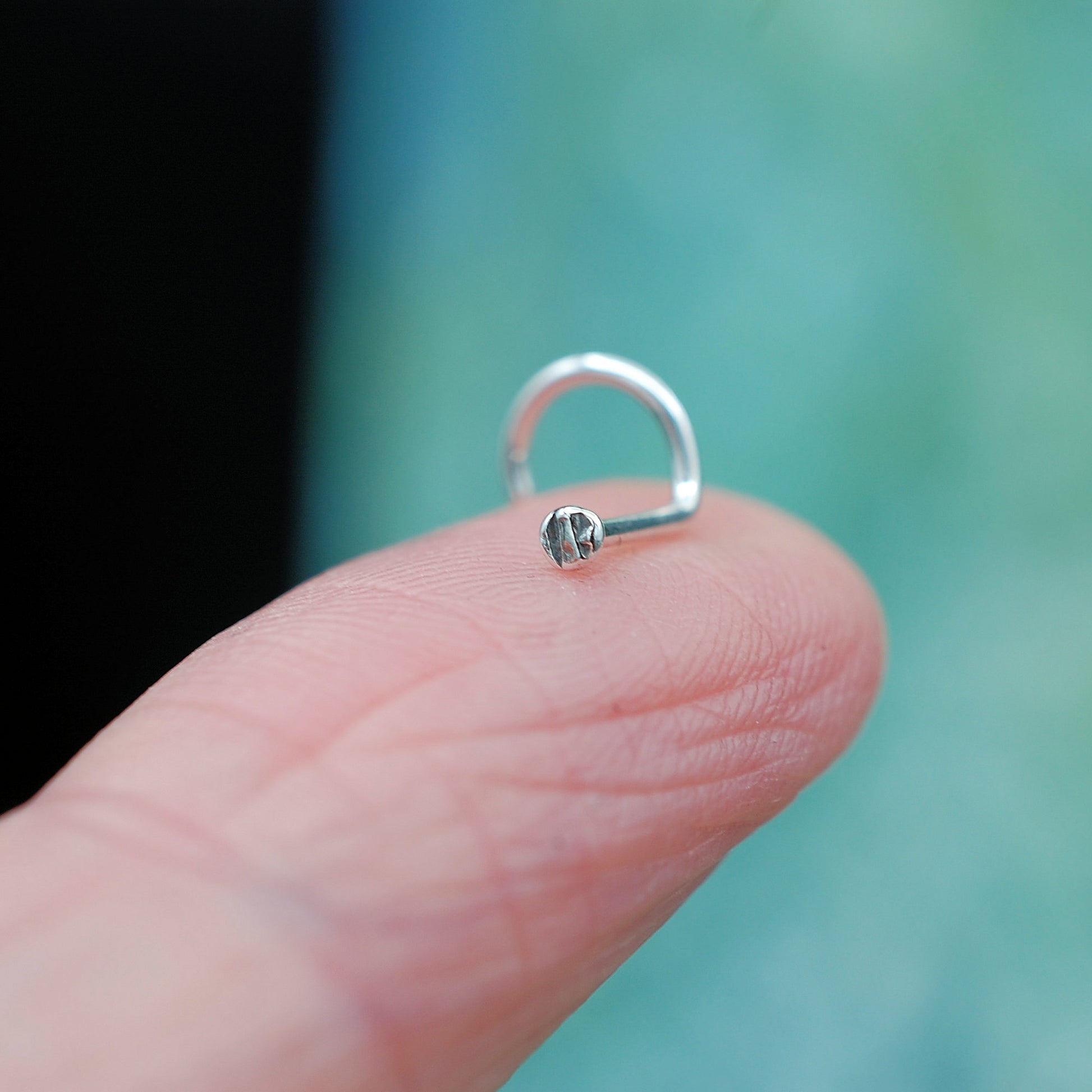 tiny silver dot disc nose stud textured pattern