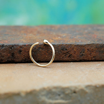 gold budded nose ring hoop shown open
