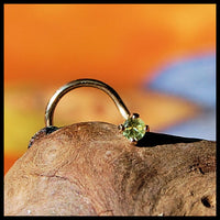 dainty peridot nose stud in yellow gold