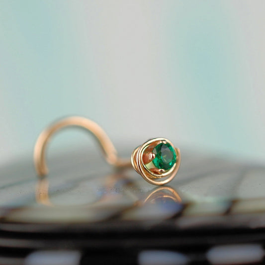 gold and emerald nose stud