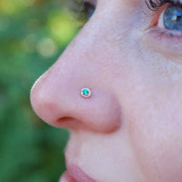 dainty emerald and 14k gold nose stud