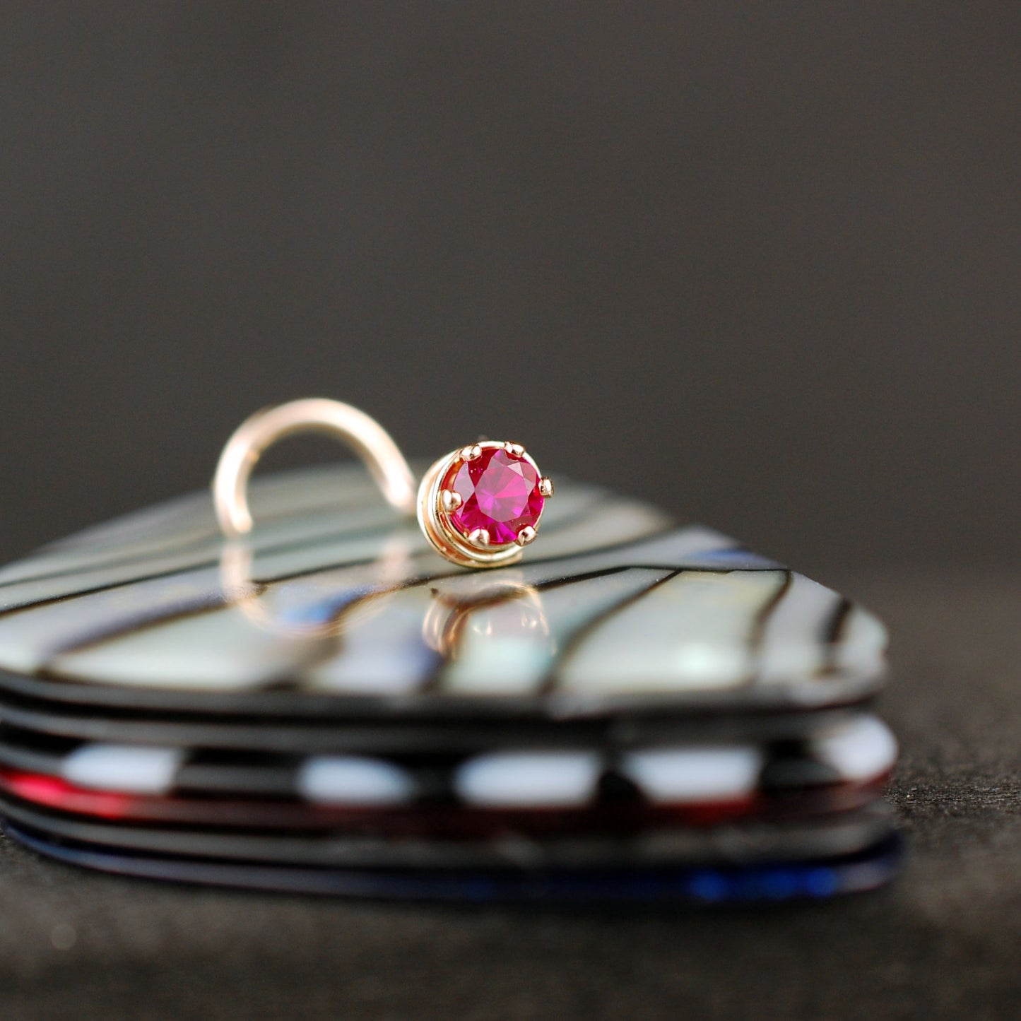 14 karat yellow gold nose jewelry with ruby gemstone