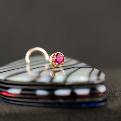 14 karat yellow gold nose jewelry with ruby gemstone