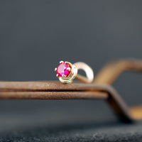dainty ruby nose stud in yellow gold