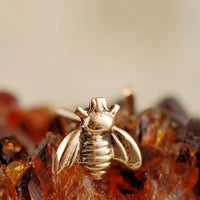 tiny bee nose stud in 14 karat gold