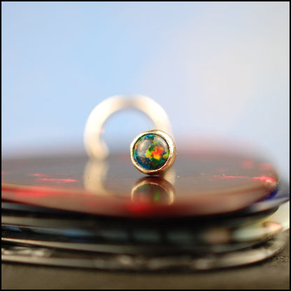 yellow gold nose stud with black opal