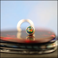 yellow gold nose stud with black opal