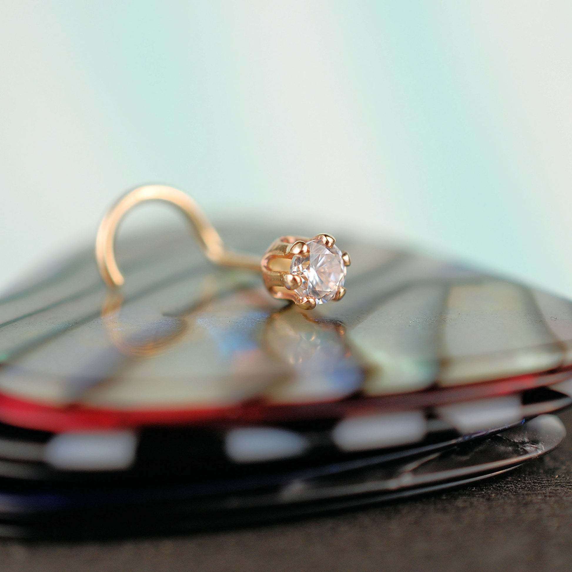 dainty gemstone nose stud in yellow gold
