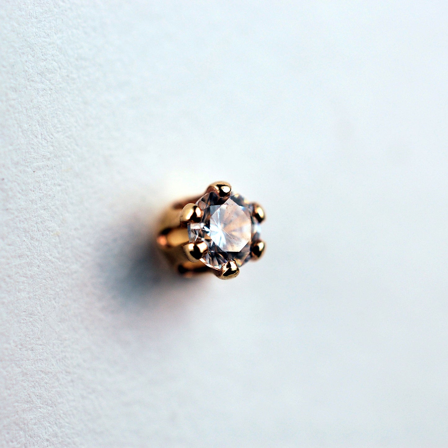 dainty gemstone nose jewelry in yellow gold