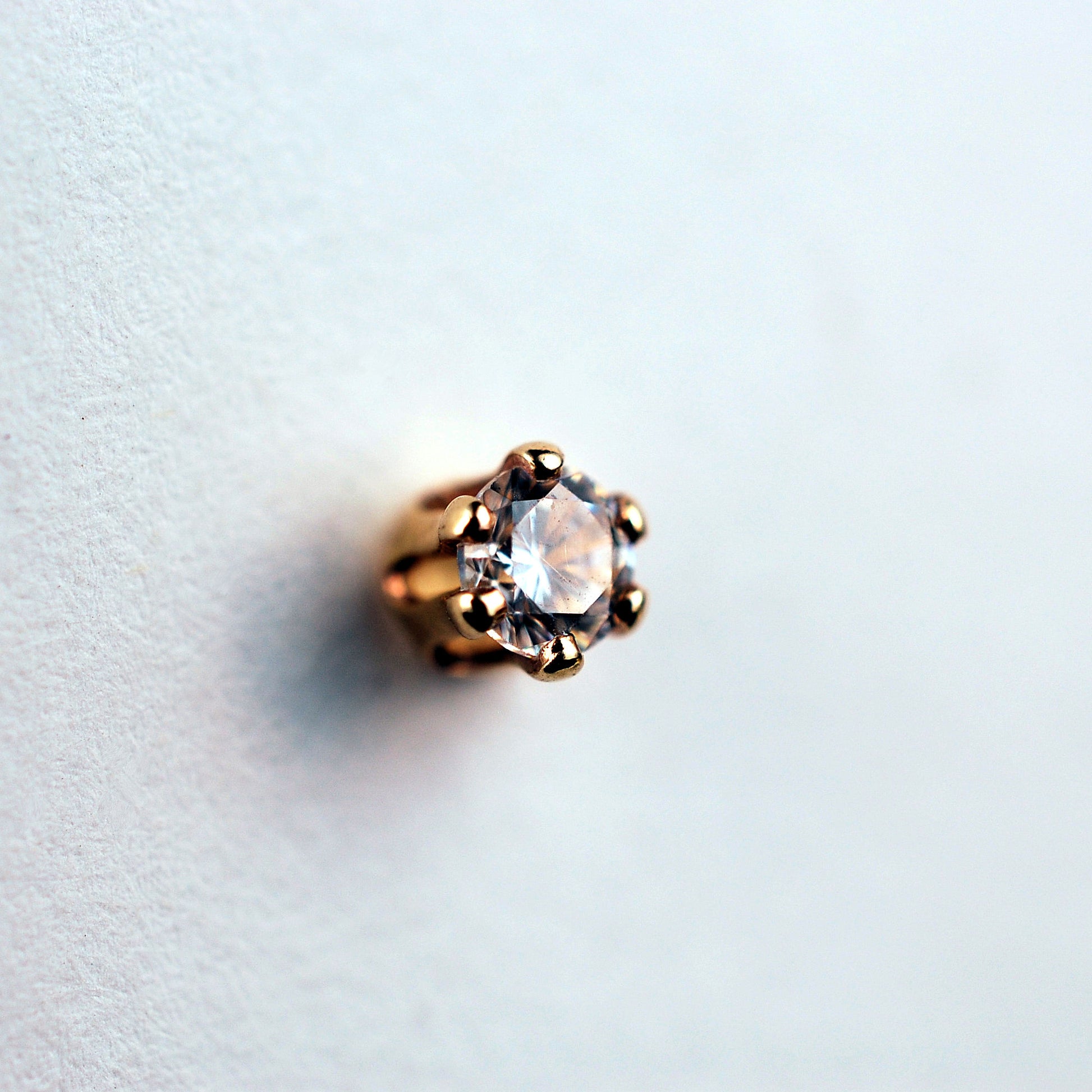 dainty gemstone nose jewelry in yellow gold
