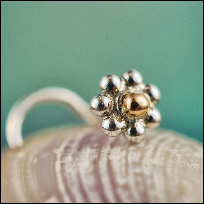 tiny flower nose stud in 14 karat yellow gold