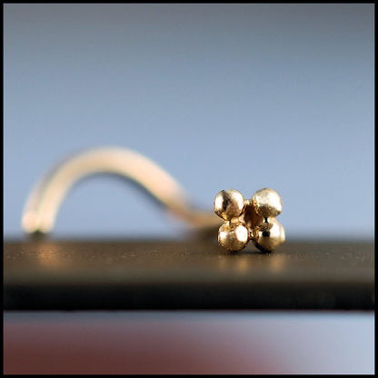 dainty 14 karat yellow gold nose jewelry