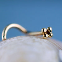 dainty 14 karat yellow gold nose stud