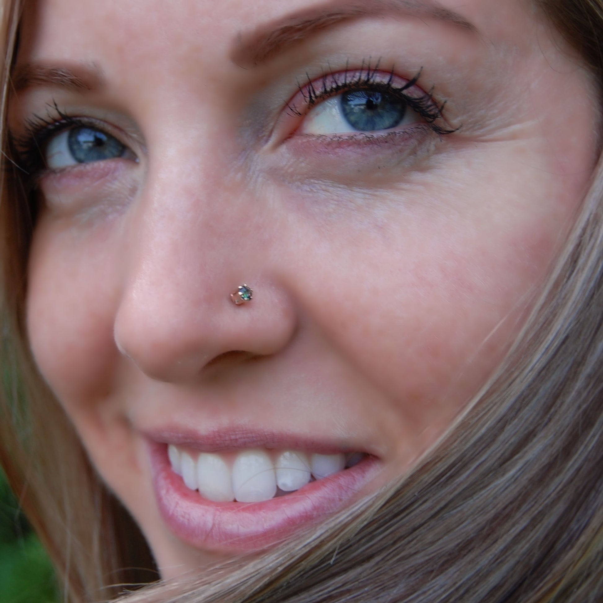 mystic topaz nose stud in yellow gold