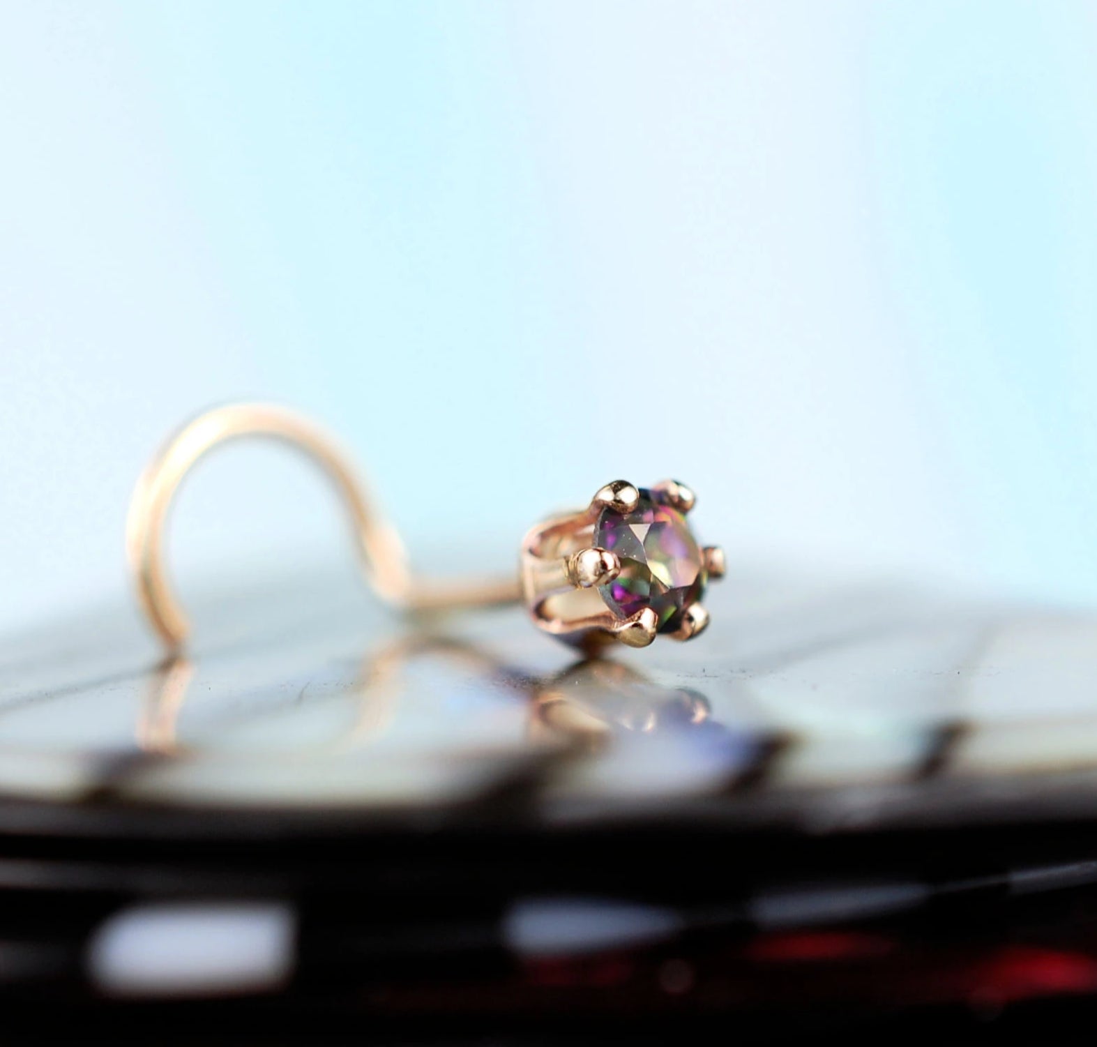 14 karat yellow gold nose jewelry with mystic topaz gemstone