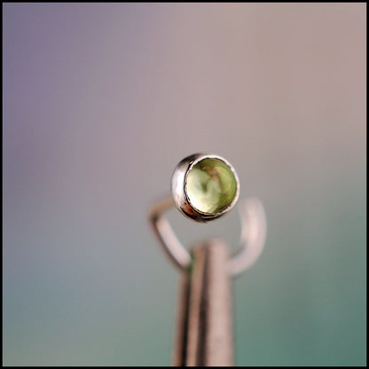 dainty peridot nose stud in sterling silver