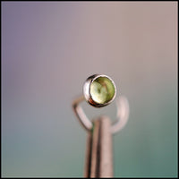 dainty peridot nose stud in sterling silver