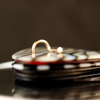 tiny gold spot nose stud