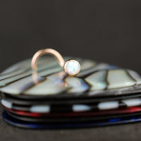 14 karat rose gold nose stud with opal gemstone