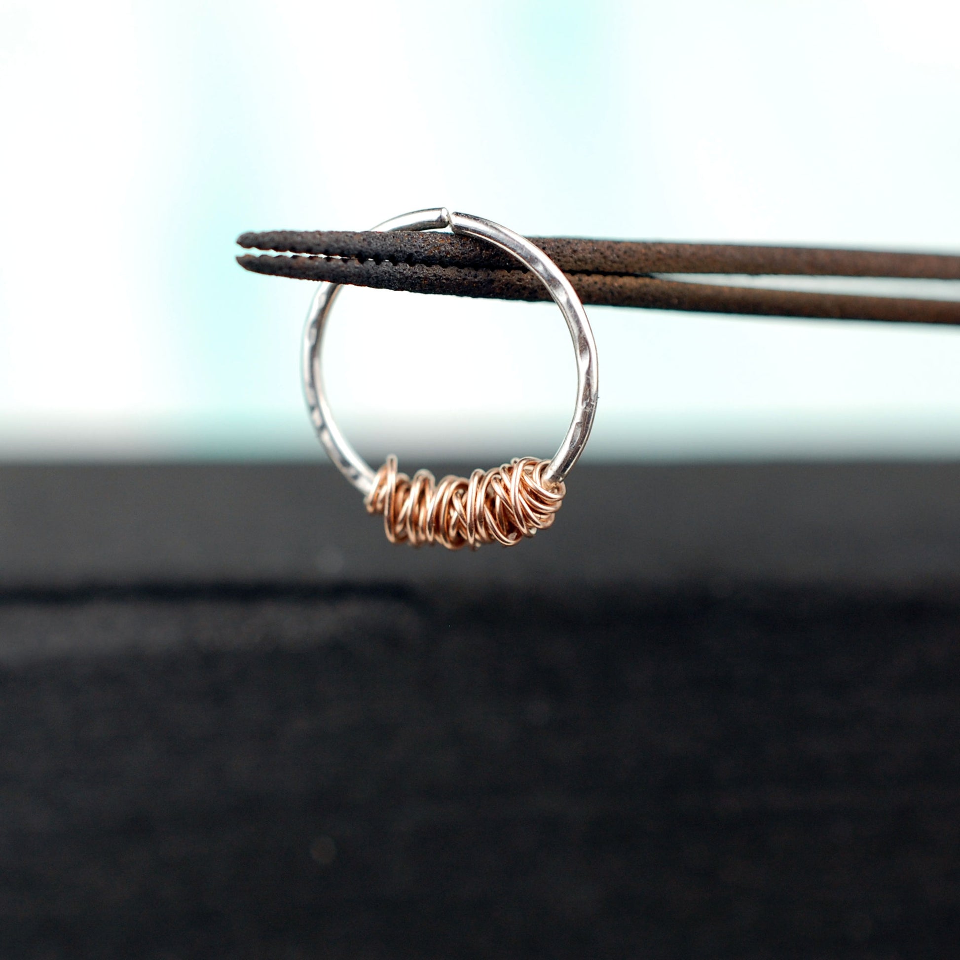 sterling silver septum hoop with 14 karat rose gold