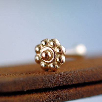 dainty flower nose stud in 14k yellow gold