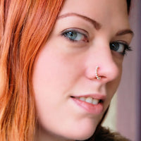 14 karat rose gold nose ring wrapped with nickel-free sterling silver