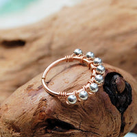 14 karat rose gold nose hoop wrapped with nickel-free sterling silver
