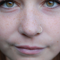 dainty yellow gold nose hoop in solid 14k gold