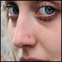 dainty silver nose stud with garnet