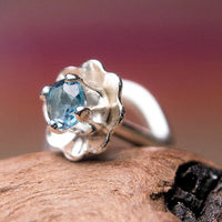 sterling silver flower nose stud with blue topaz gemstone