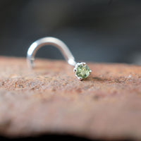 tiny silver and green nose stud